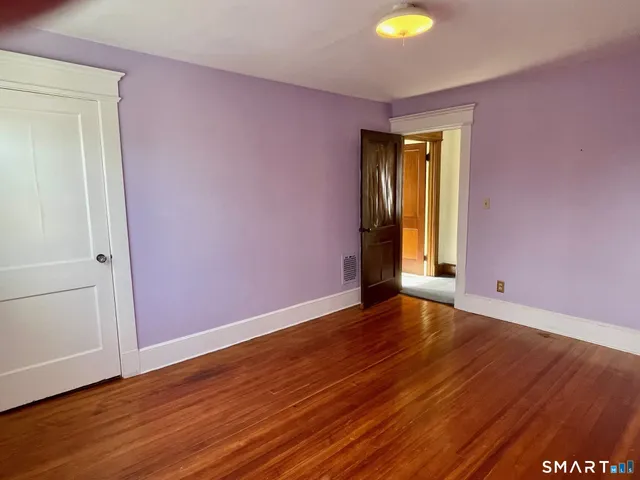 a view of wooden floor in an empty room