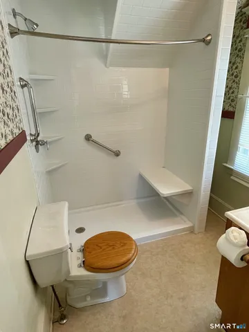a bathroom with a sink and toilet