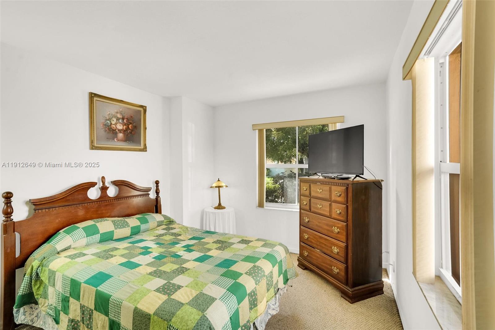 13117 Southwest 49th Court Miramar, FL 33027 - Photo 23 of 65 a bedroom with a bed and a television