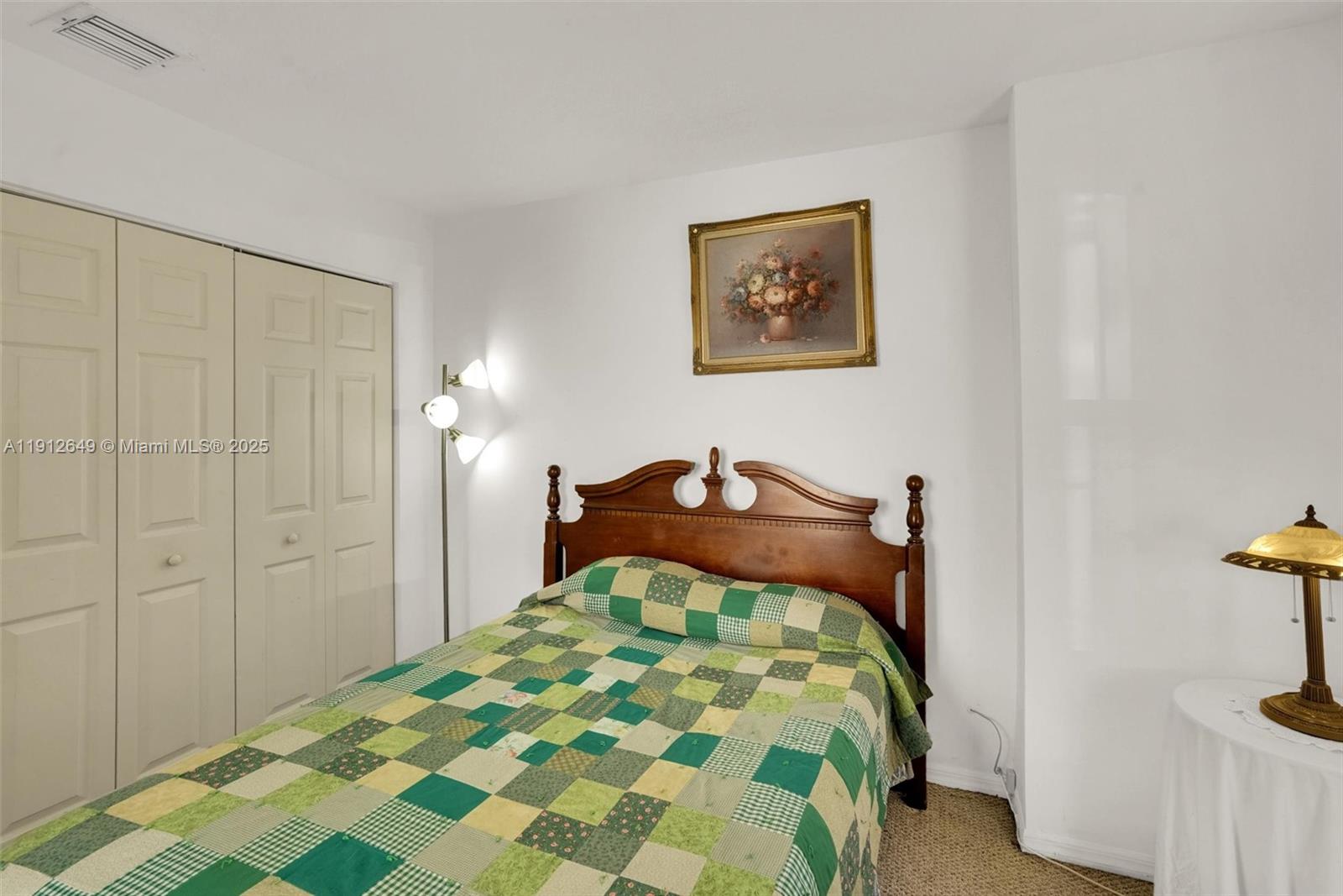 13117 Southwest 49th Court Miramar, FL 33027 - Photo 25 of 65 a bedroom with a bed and a painting on the wall
