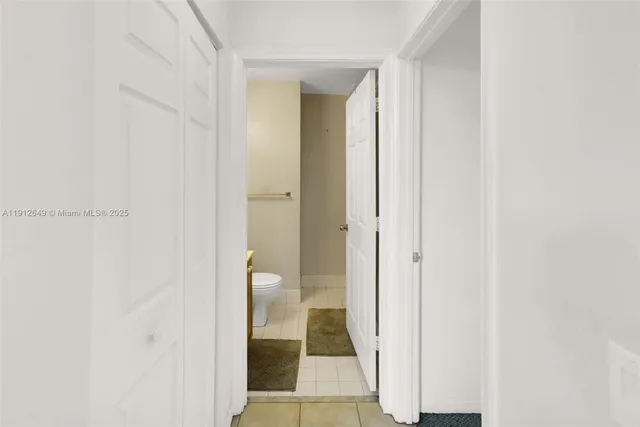 a bathroom with a sink toilet and mirror