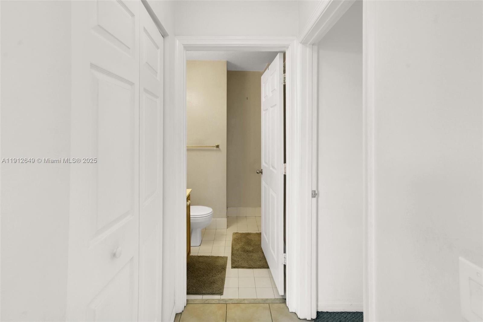 13117 Southwest 49th Court Miramar, FL 33027 - Photo 27 of 65 a view of a bathroom from a hallway