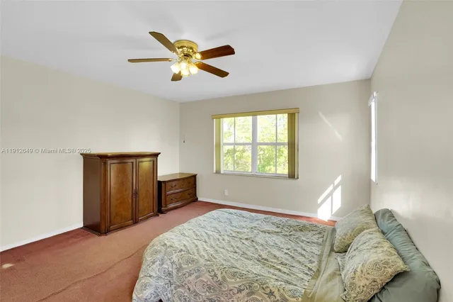 a bathroom with a granite countertop sink and a bathtub