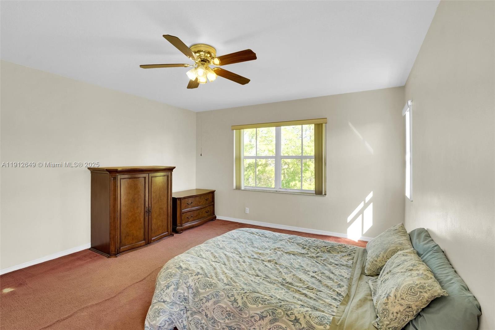 13117 Southwest 49th Court Miramar, FL 33027 - Photo 33 of 65 a bedroom with a bed and a window