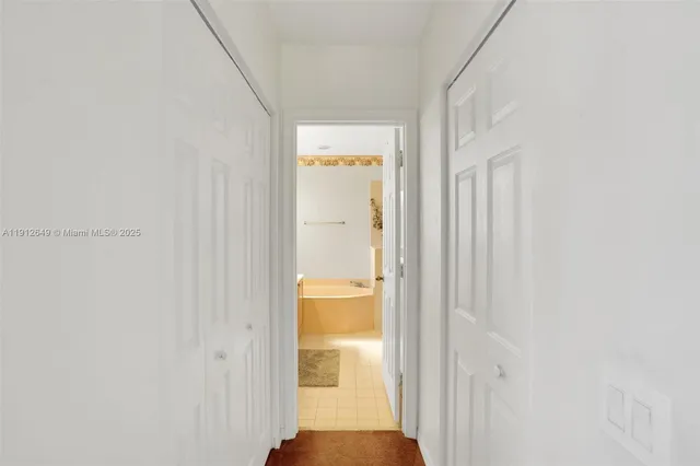 a bedroom with a bed and a ceiling fan