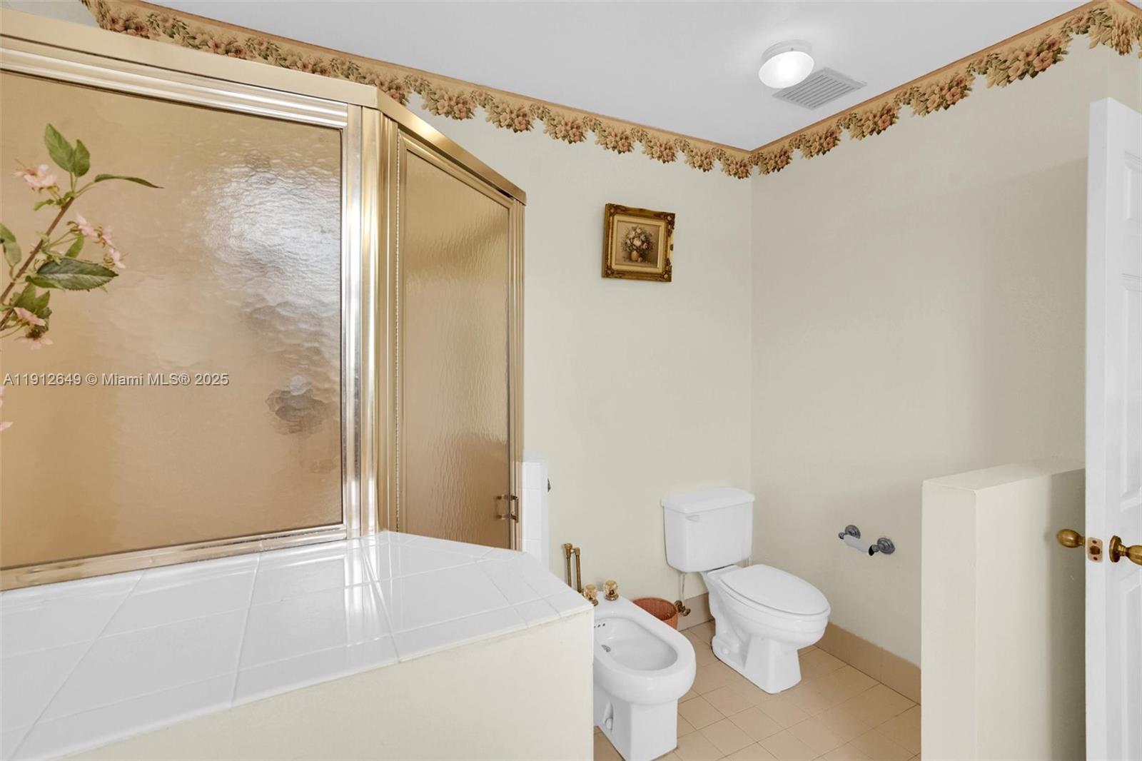 13117 Southwest 49th Court Miramar, FL 33027 - Photo 38 of 65 a bathroom with a shower and a toilet