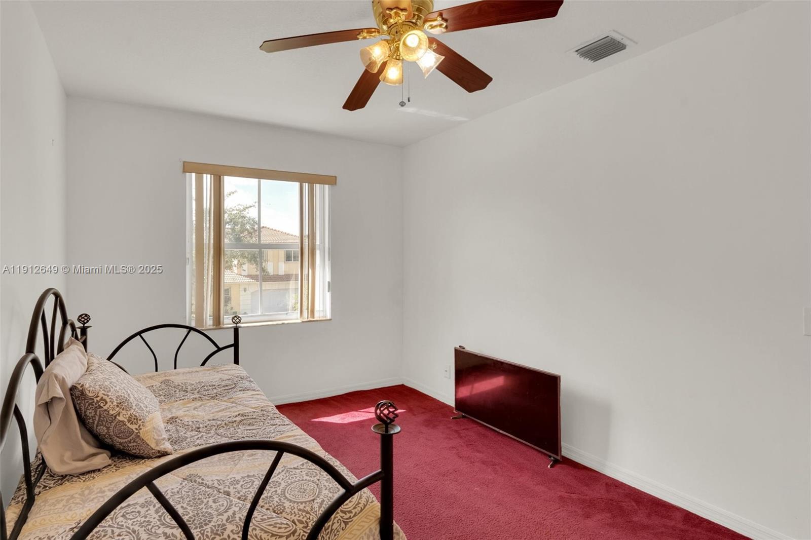 13117 Southwest 49th Court Miramar, FL 33027 - Photo 41 of 65 a bedroom with furniture and window