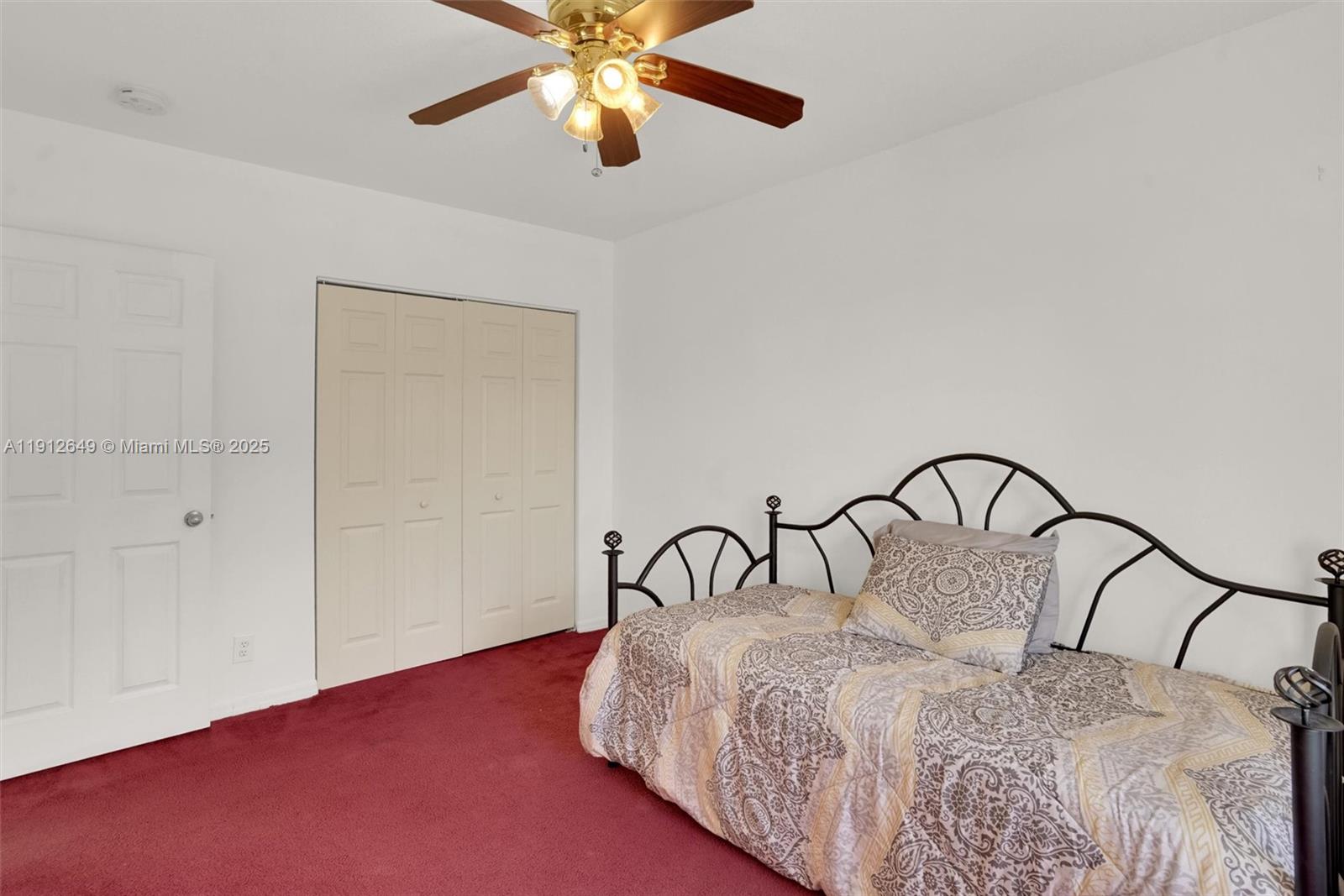 13117 Southwest 49th Court Miramar, FL 33027 - Photo 42 of 65 a bedroom with a bed and a ceiling fan