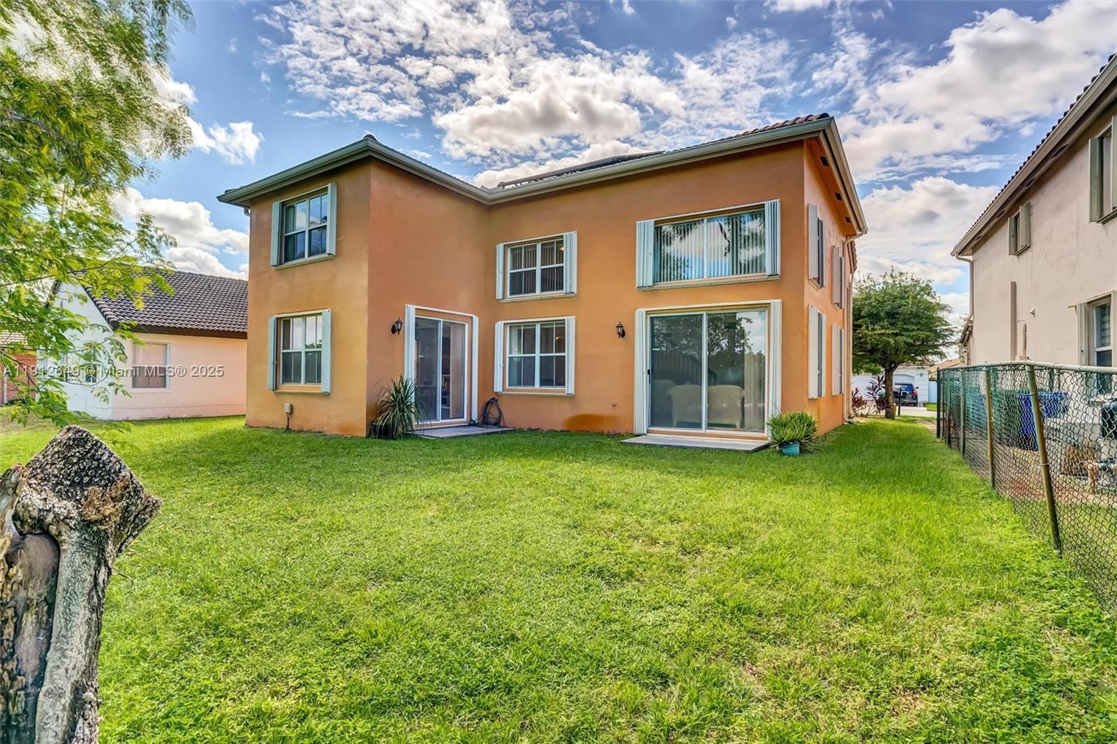13117 Southwest 49th Court Miramar, FL 33027 - Photo 50 of 65 front view of a house with a yard