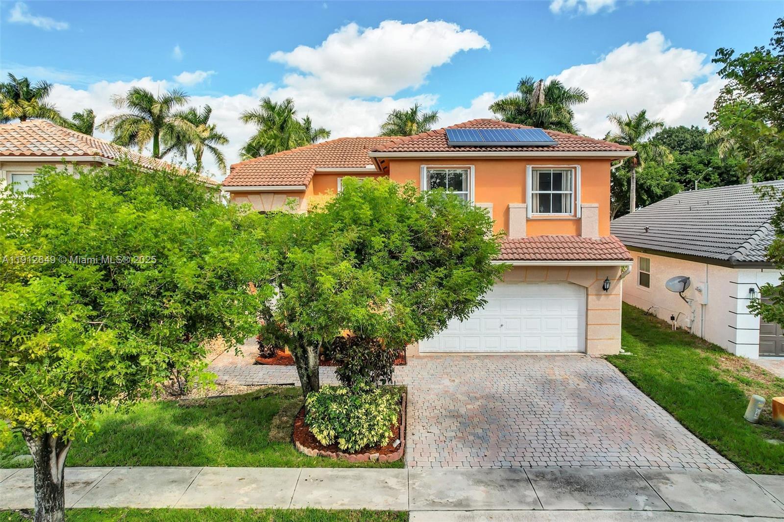13117 Southwest 49th Court Miramar, FL 33027 - Photo 52 of 65 front view of a house with a yard