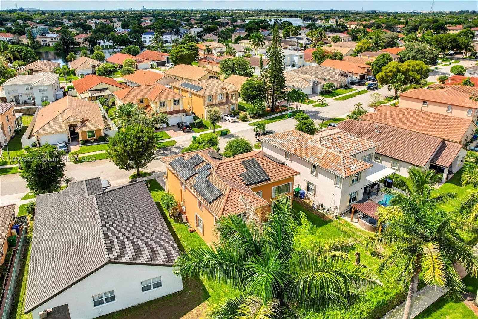 13117 Southwest 49th Court Miramar, FL 33027 - Photo 64 of 65 an aerial view of residential houses with outdoor space and parking