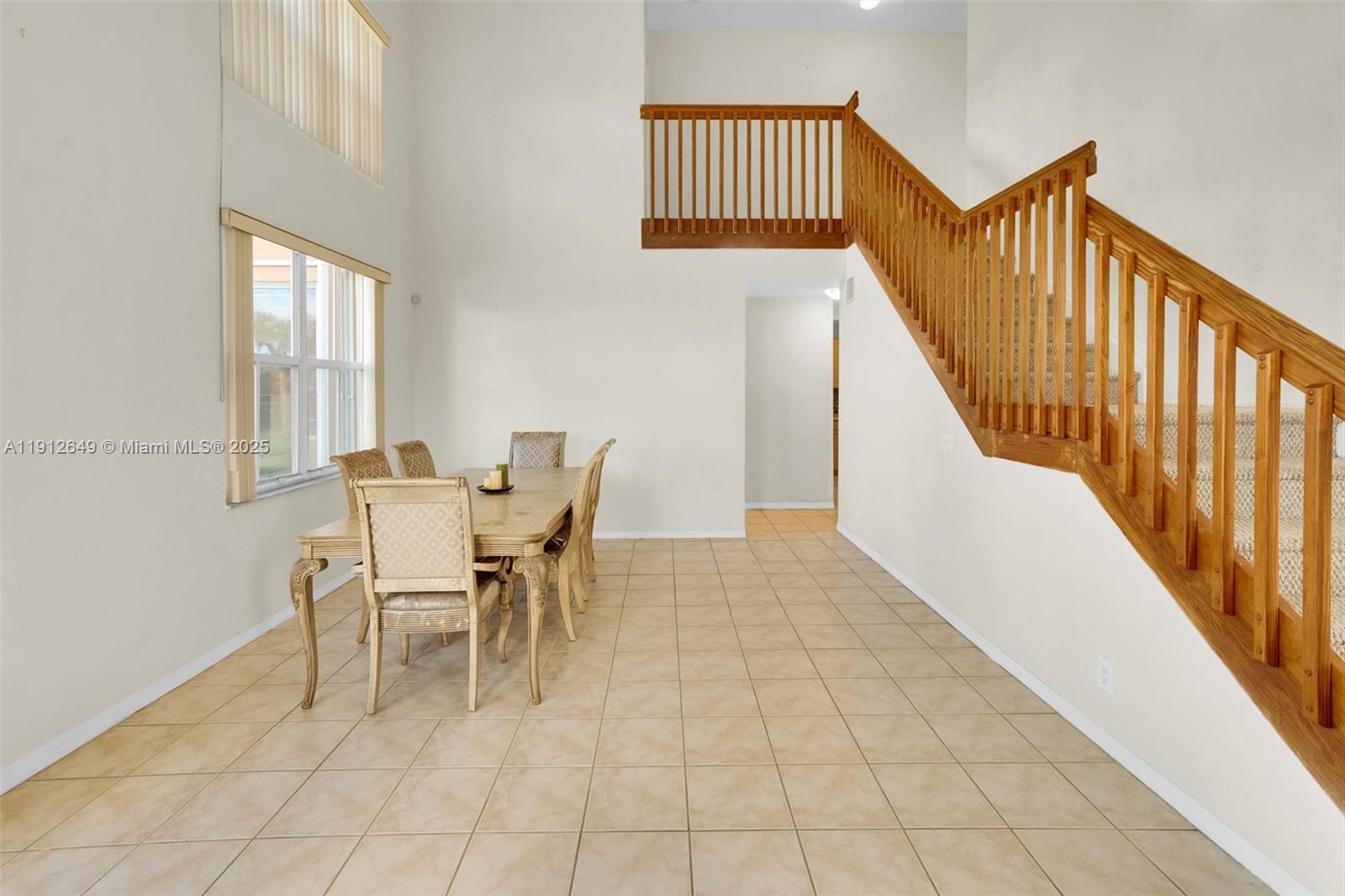 13117 Southwest 49th Court Miramar, FL 33027 - Photo 9 of 65 a view of a dining room with furniture and wooden floor
