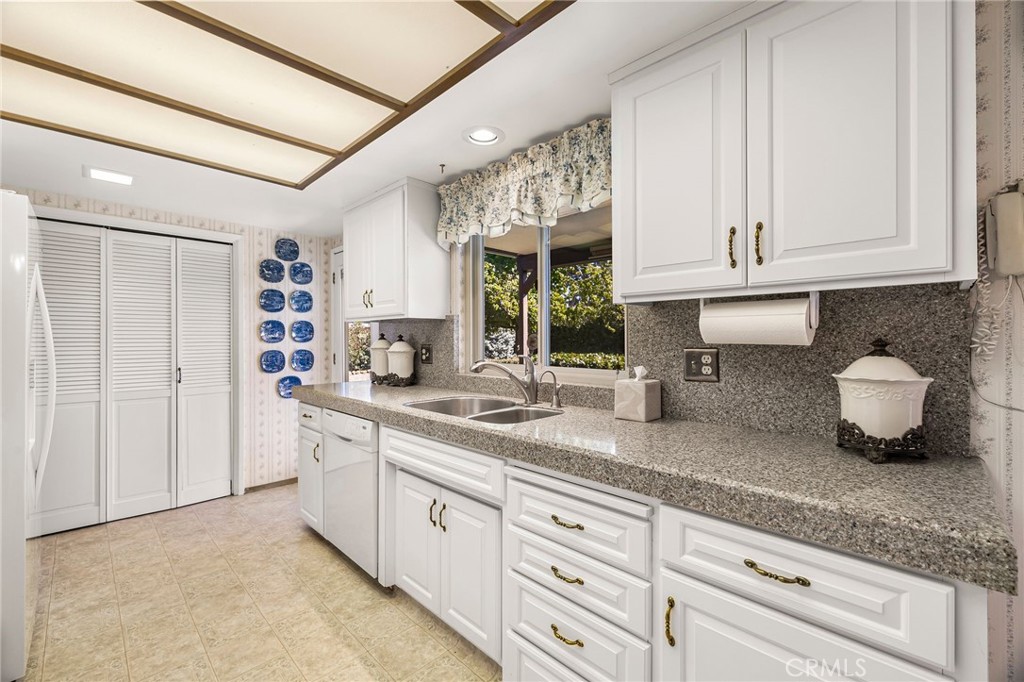 5770 Ingalls Road Paradise, CA 95969 - Photo 16 of 63 a kitchen with granite countertop a sink and cabinets
