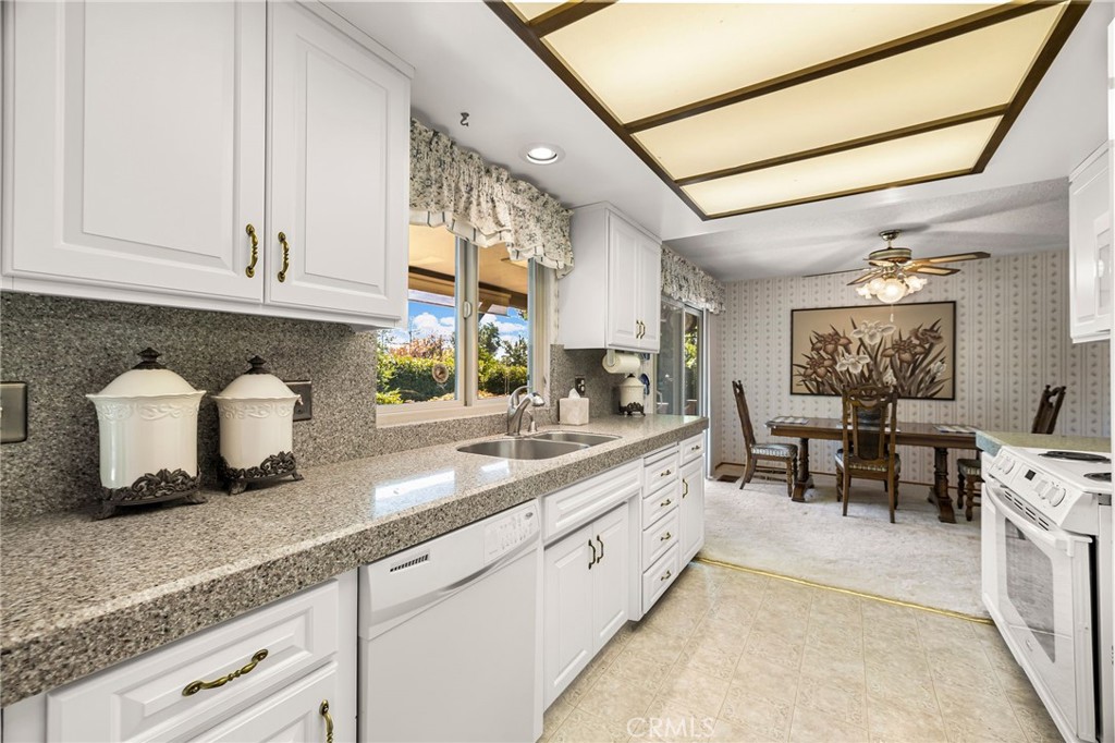 5770 Ingalls Road Paradise, CA 95969 - Photo 18 of 63 a kitchen with stainless steel appliances granite countertop a sink and cabinets