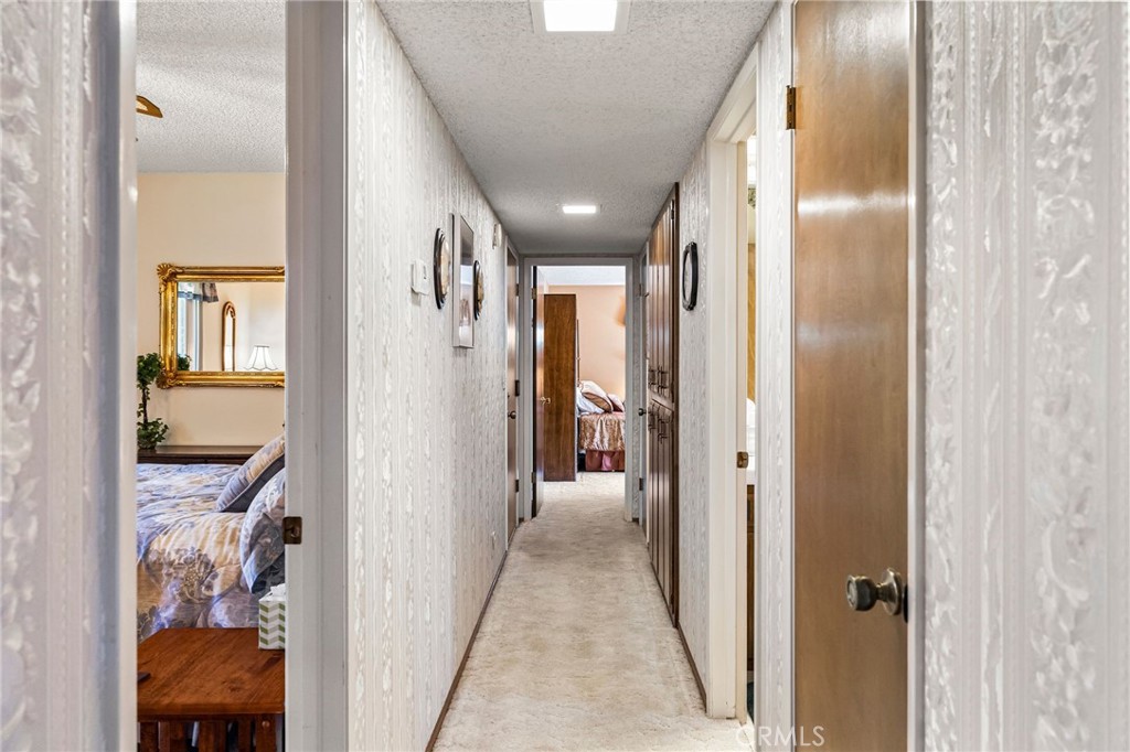 5770 Ingalls Road Paradise, CA 95969 - Photo 23 of 63 a view of a hallway with a livingroom and a bathroom with sink