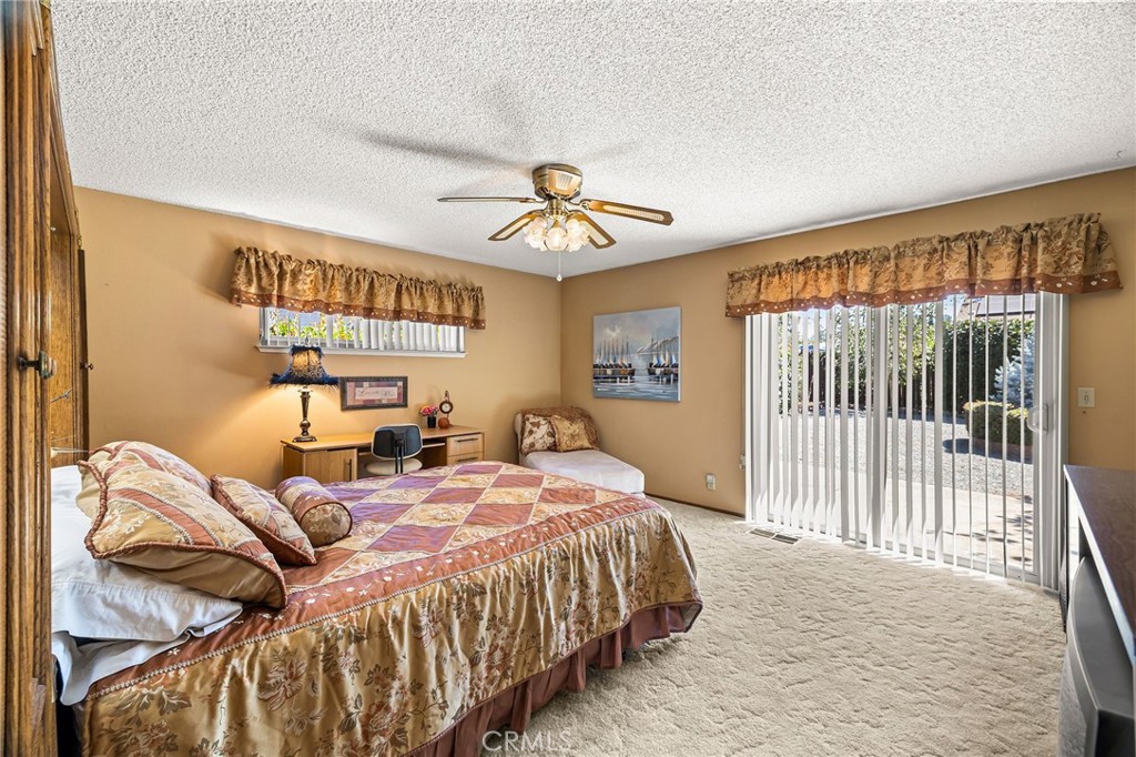 5770 Ingalls Road Paradise, CA 95969 - Photo 25 of 63 a bedroom with a bed and a chandelier