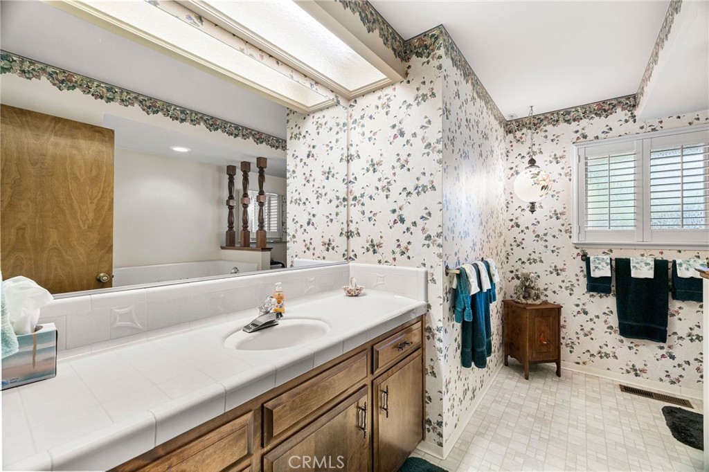5770 Ingalls Road Paradise, CA 95969 - Photo 35 of 63 a bathroom with a sink double vanity and a bathtub