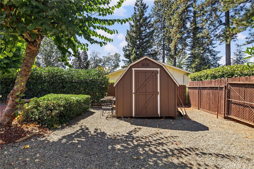 5770 Ingalls Road Paradise, CA 95969 - Photo 44 of 63 a view of a barn with a small yard and large trees