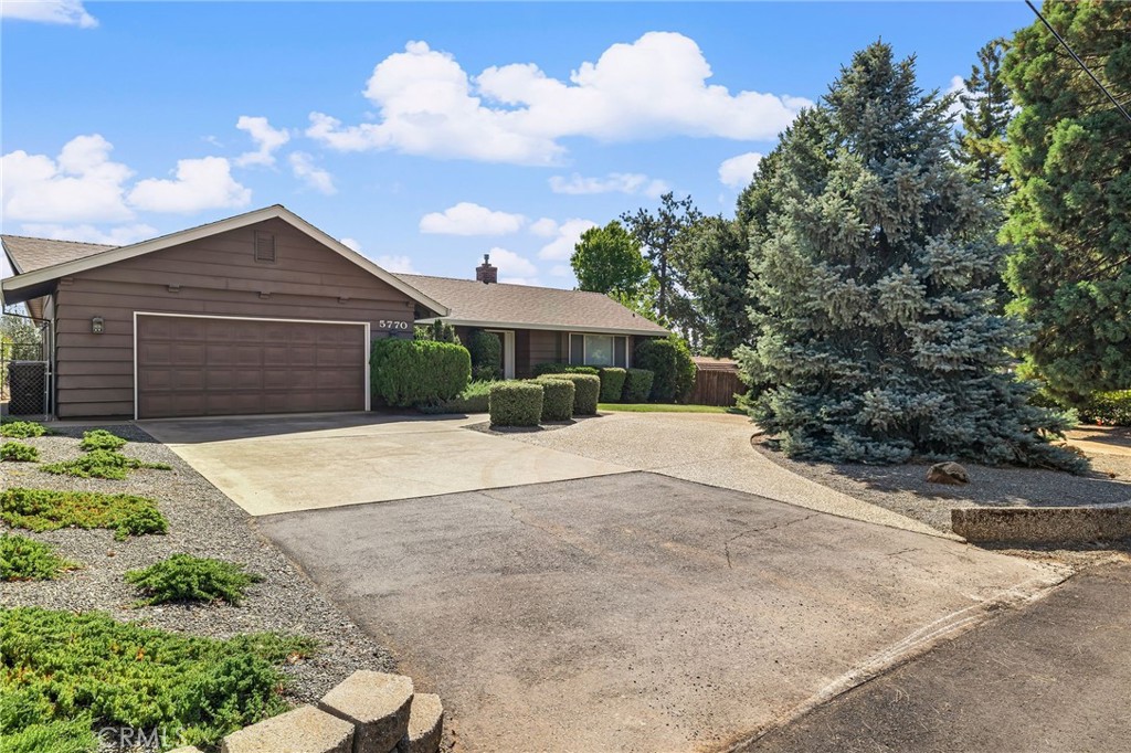 5770 Ingalls Road Paradise, CA 95969 - Photo 52 of 63 a front view of a house with a yard and garage