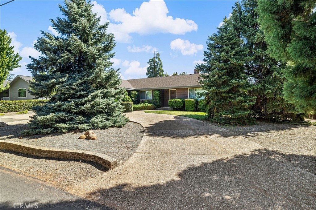 5770 Ingalls Road Paradise, CA 95969 - Photo 53 of 63 a view of a patio with a table and chairs under an umbrella