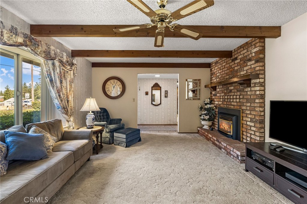 5770 Ingalls Road Paradise, CA 95969 - Photo 7 of 63 a living room with furniture a fireplace and a flat screen tv