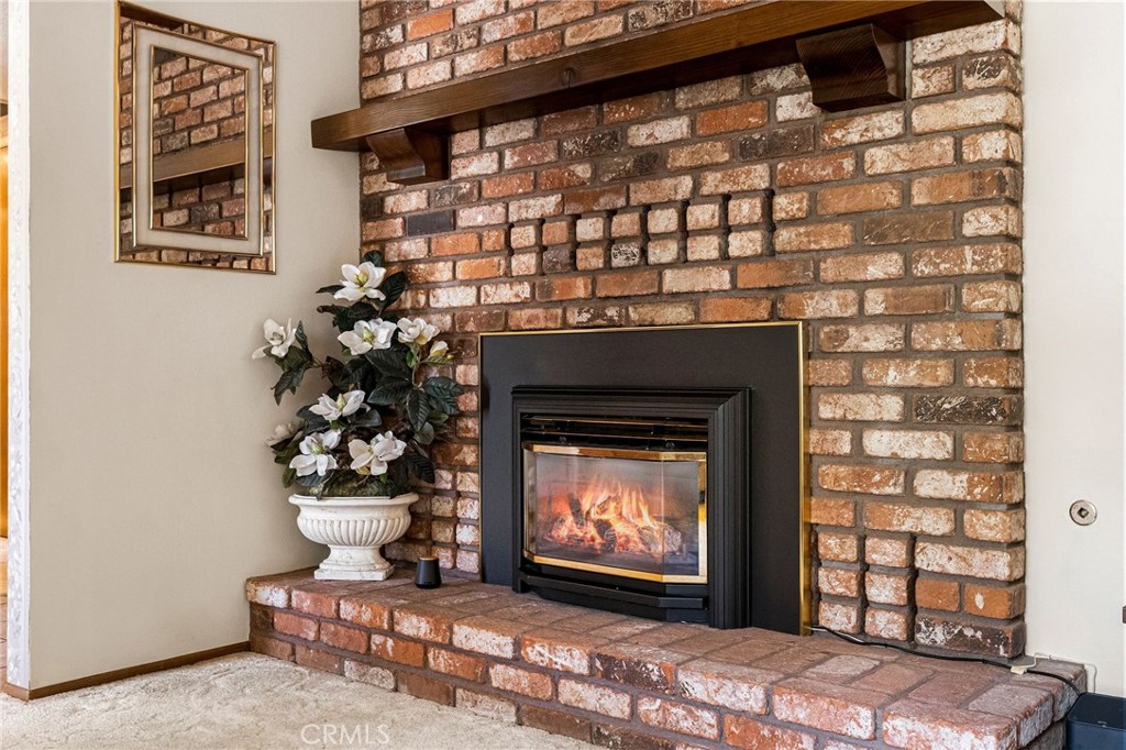 5770 Ingalls Road Paradise, CA 95969 - Photo 8 of 63 a living room with a fireplace and a potted plant