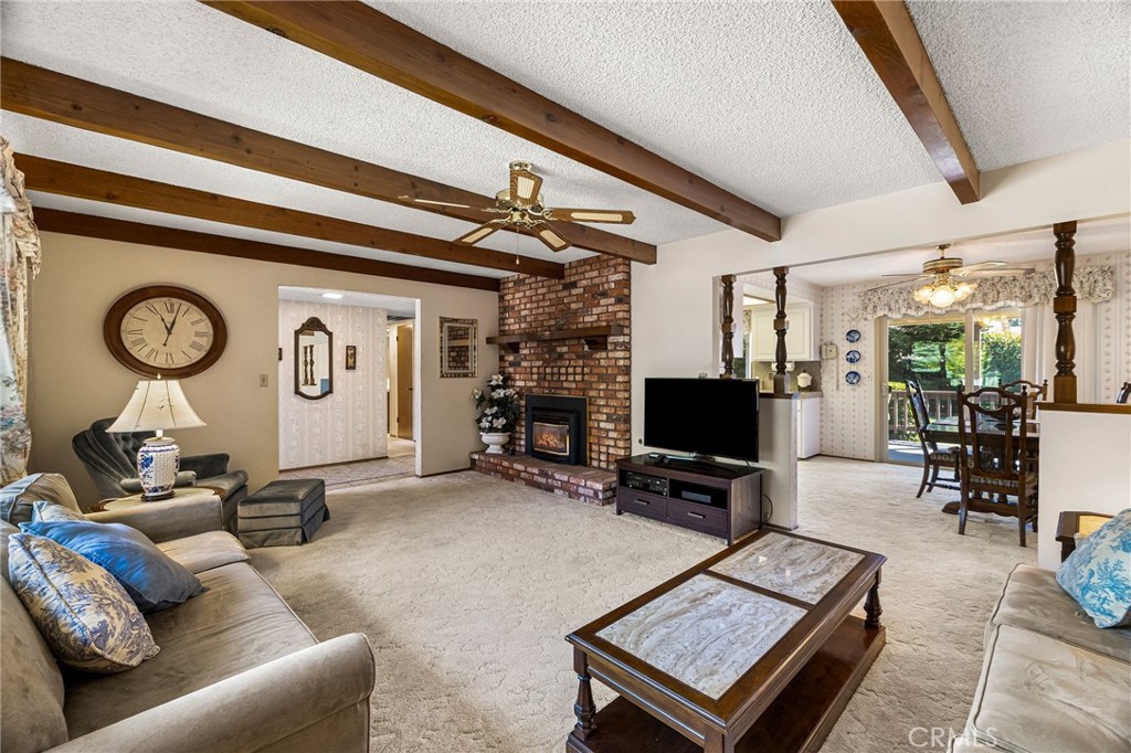 5770 Ingalls Road Paradise, CA 95969 - Photo 10 of 63 a living room with furniture a clock on wall and a table