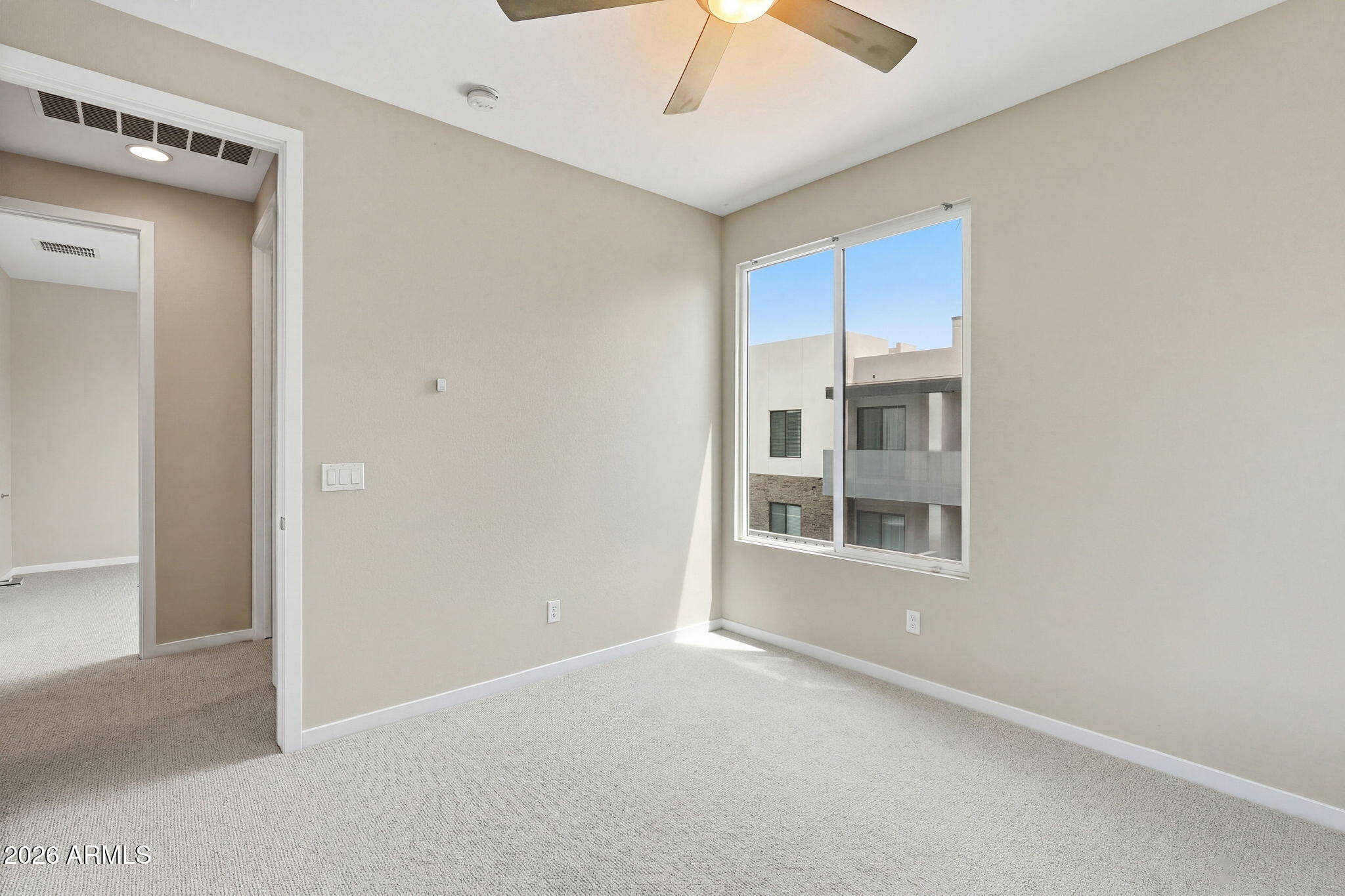 901 South Smith Road, Unit 1038 Tempe, AZ 85281 - Photo 25 of 29 a view of an empty room with a window