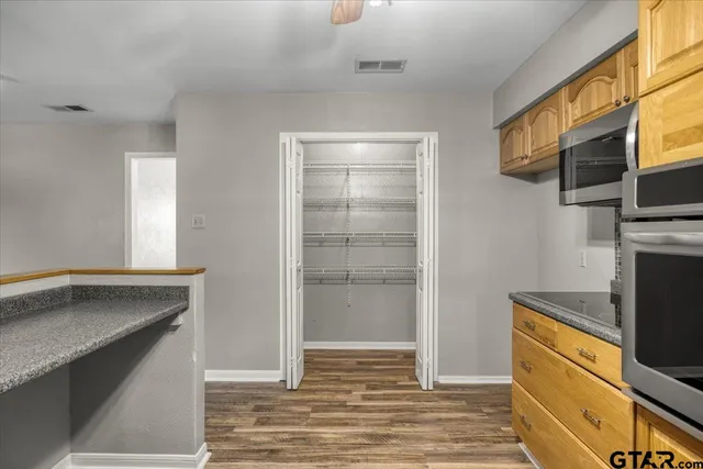 a kitchen with a refrigerator and a sink