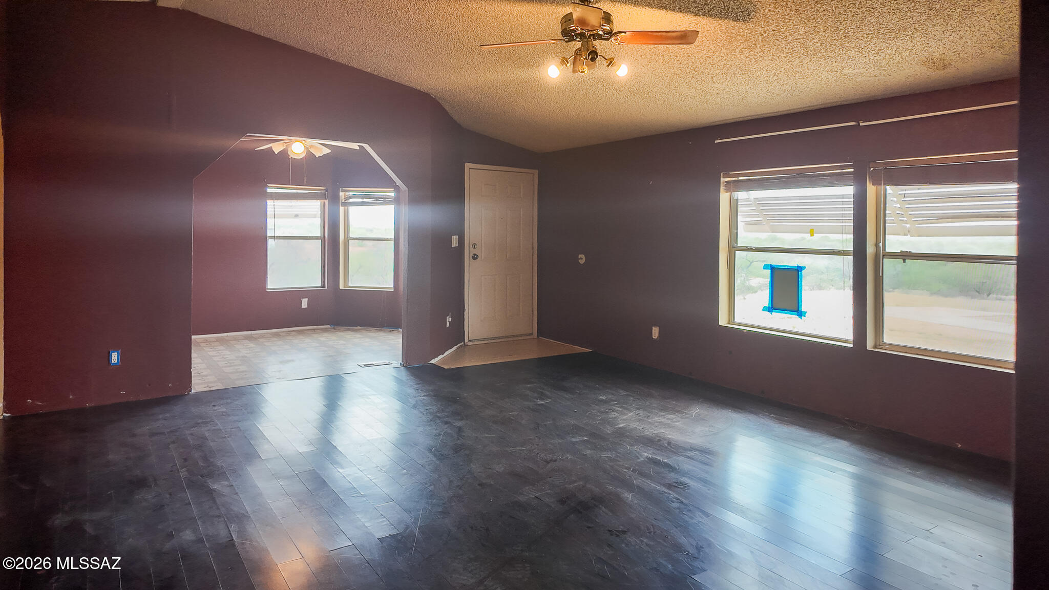 27651 South Canoa Road Amado, AZ 85645 - Photo 7 of 20 a view of livingroom with a ceiling fan and wooden floor