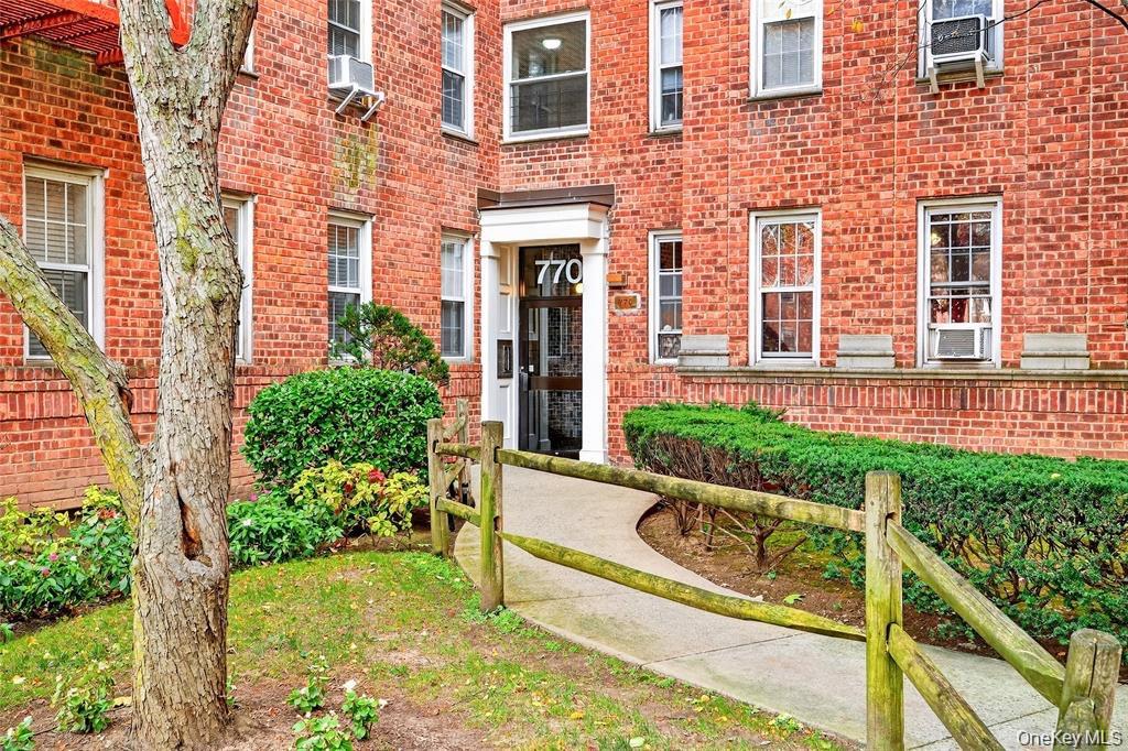 770 Bronx River Road, Unit A41 Yonkers, NY 10708 - Photo 2 of 10 front view of house with a yard