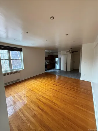 an empty room with a empty space and windows