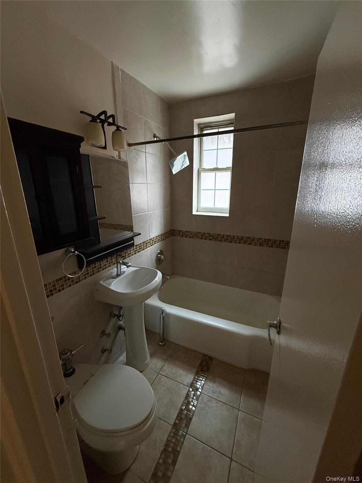 770 Bronx River Road, Unit A41 Yonkers, NY 10708 - Photo 7 of 10 a bathroom with a sink toilet and shower
