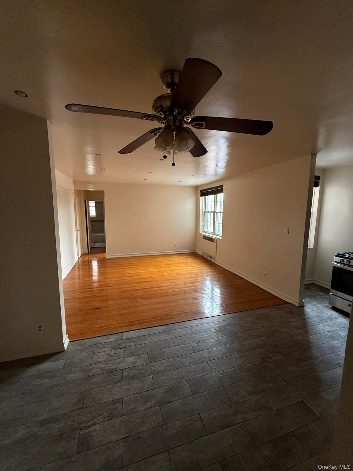 770 Bronx River Road, Unit A41 Yonkers, NY 10708 - Photo 10 of 10 a view of an empty room with window and wooden floor