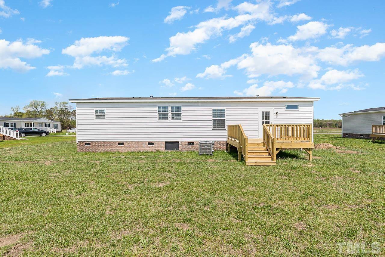 34 Ruddy Duck Lane Pine Level, NC 27576 - Photo 16 of 17 a view of a house with a backyard
