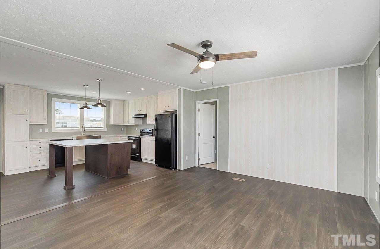 34 Ruddy Duck Lane Pine Level, NC 27576 - Photo 2 of 17 a view of kitchen with wooden floor and electronic appliances