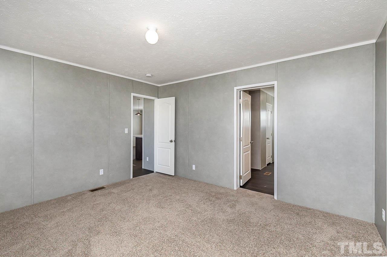34 Ruddy Duck Lane Pine Level, NC 27576 - Photo 9 of 17 a view of an empty room