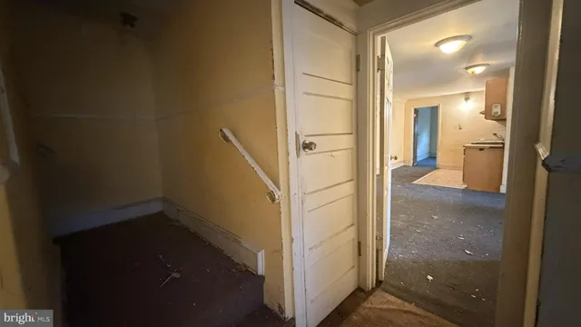 a view of a hallway with a room