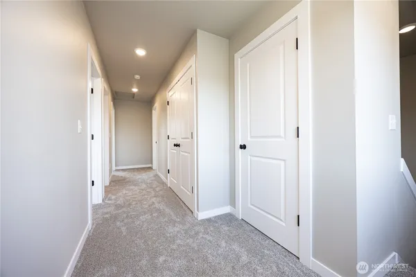 an entryway with a white walls