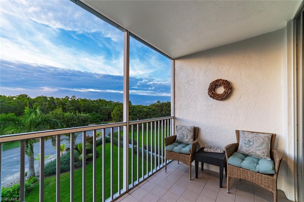 5 Bluebill Avenue, Unit 305 405 Naples, FL 34108 - Photo 19 of 30 a view of a chairs and table in patio