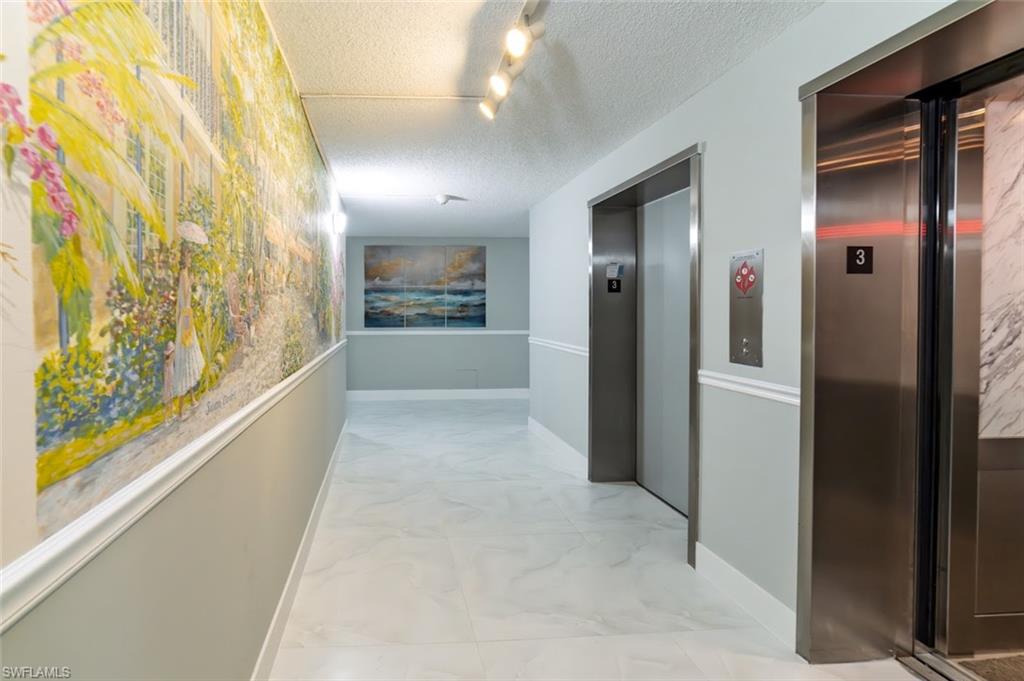 5 Bluebill Avenue, Unit 305 405 Naples, FL 34108 - Photo 21 of 30 a view of hallway with stairs