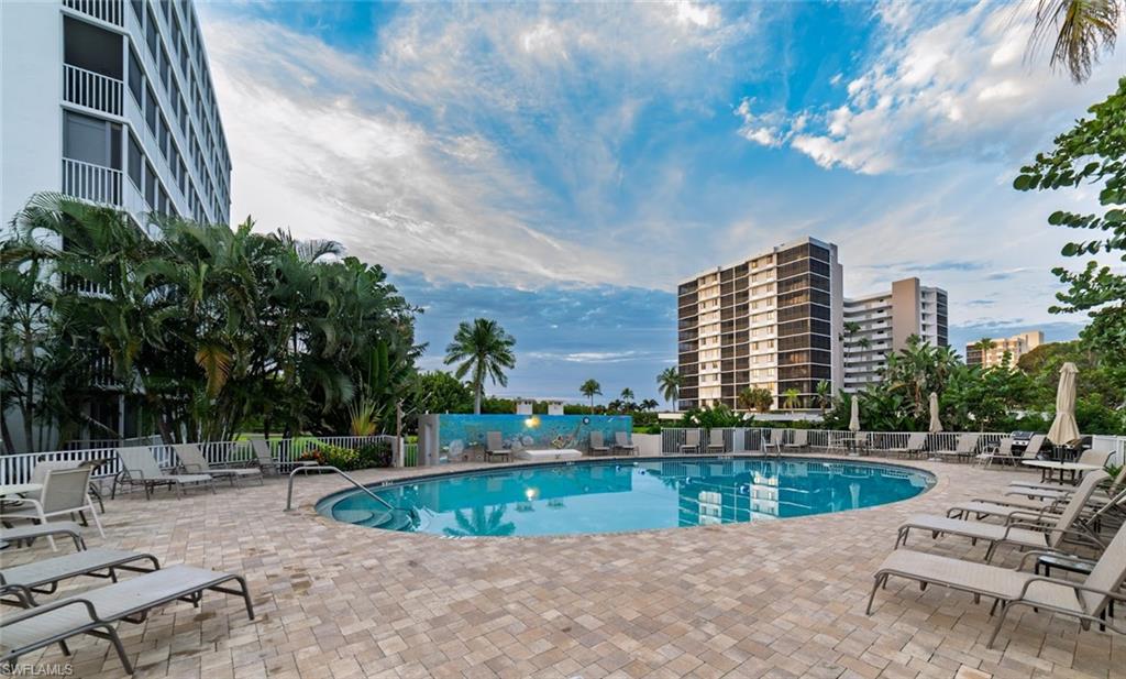 5 Bluebill Avenue, Unit 305 405 Naples, FL 34108 - Photo 22 of 30 a view of a swimming pool with a patio