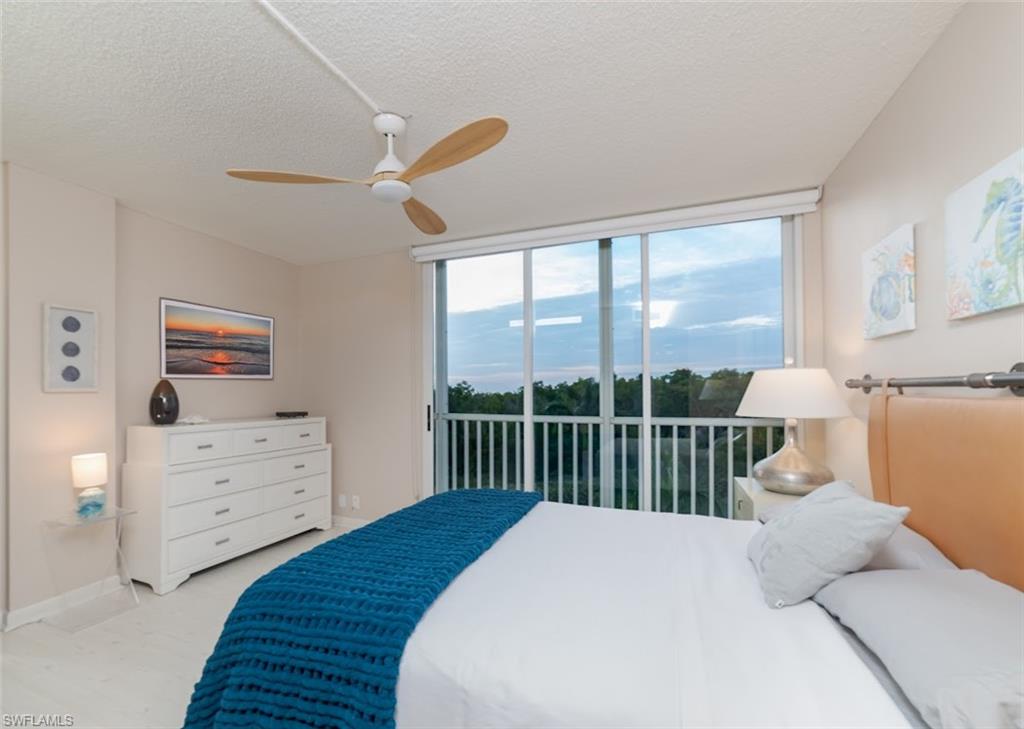 5 Bluebill Avenue, Unit 305 405 Naples, FL 34108 - Photo 8 of 30 a bedroom with a bed and a window