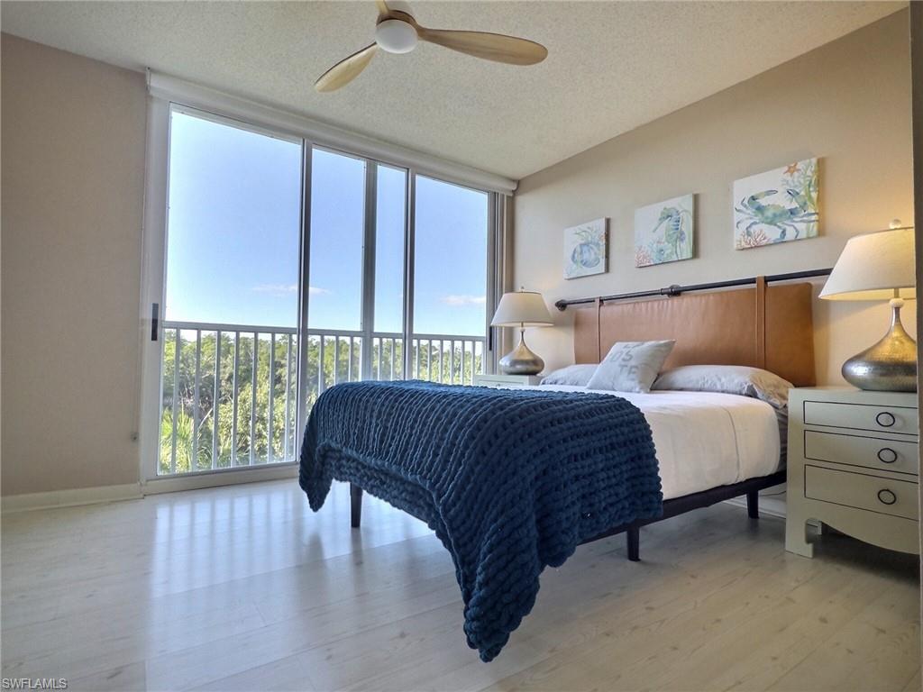 5 Bluebill Avenue, Unit 305 405 Naples, FL 34108 - Photo 10 of 30 a bedroom with a bed and a window