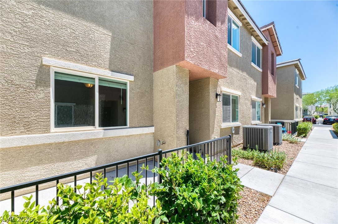 12105 Scarlet Ember Road, Unit 2 Las Vegas, NV 89183 - Photo 18 of 24 Clean lines and durable stucco siding define this modern townhome's facade.