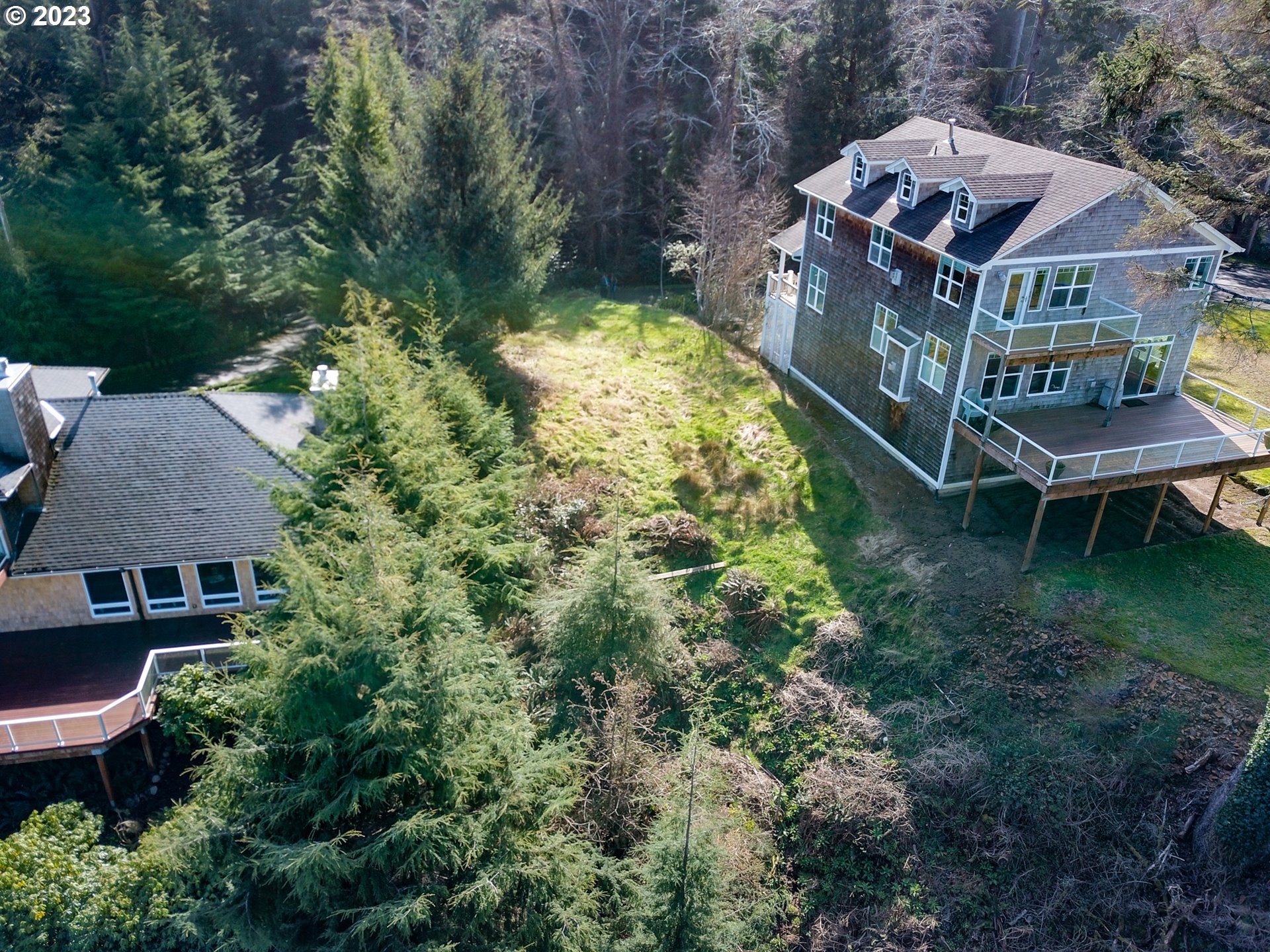300 Sunset Boulevard Seaside, OR 97138 - Photo 6 of 6 an aerial view of residential house with outdoor space and trees all around