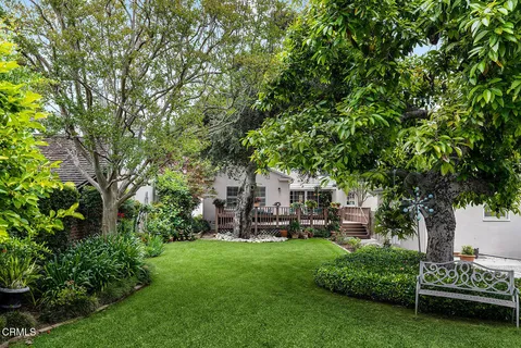 a view of a house with a backyard