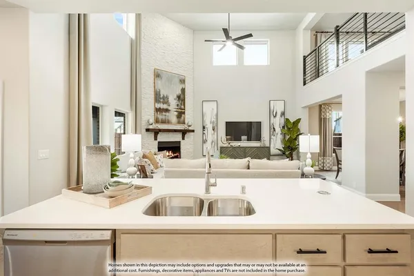 a kitchen with a sink and a refrigerator