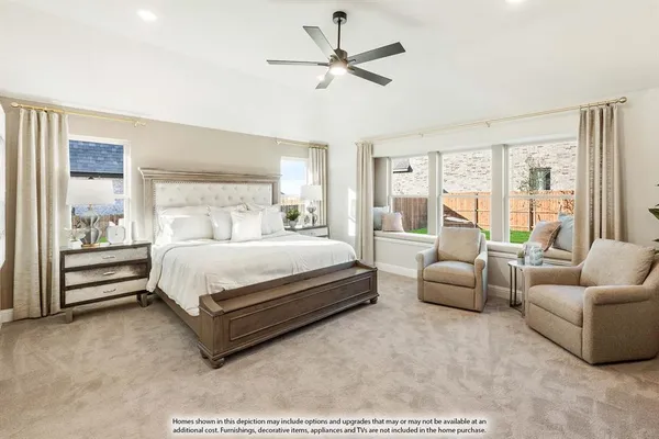a bedroom with a bed couch and window