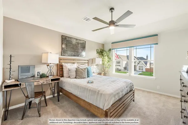 a bedroom with a bed a chandelier and a window